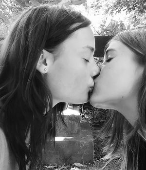 2 beautiful girls kissing
